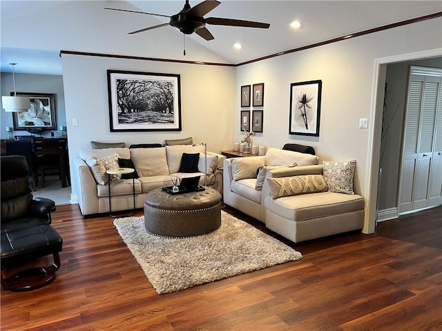 living room with ceiling fan, ornamental molding, dark hardwood / wood-style floors, and lofted ceiling