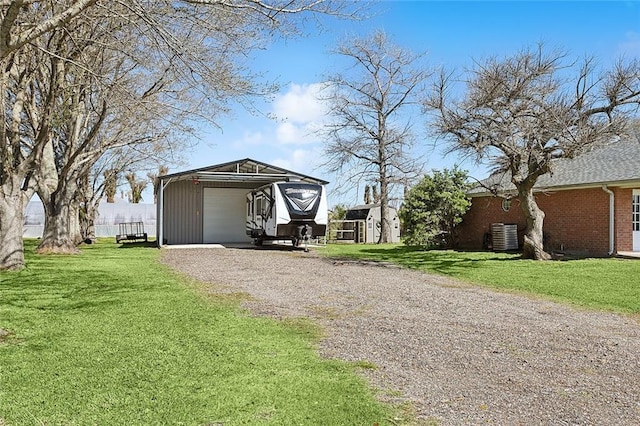 exterior space with an outdoor structure and driveway