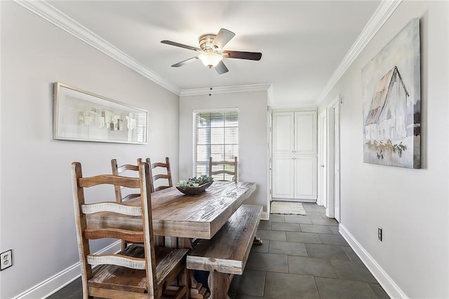 dining space featuring crown molding, a ceiling fan, and baseboards