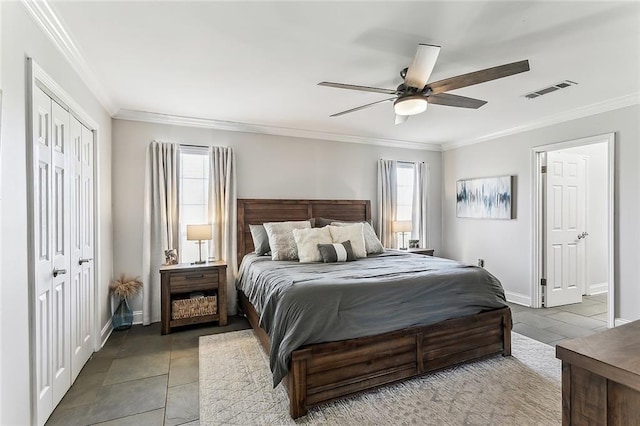 tiled bedroom with crown molding, baseboards, and visible vents