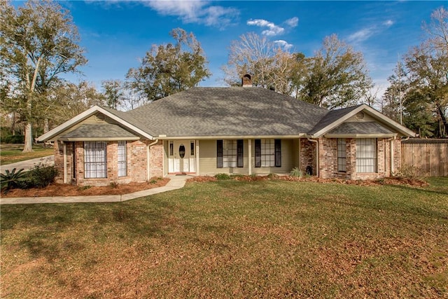 single story home featuring a front yard