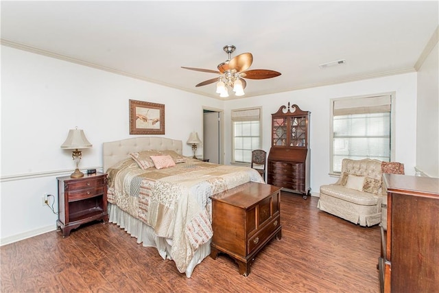 bedroom with ornamental molding, ceiling fan, and dark hardwood / wood-style flooring