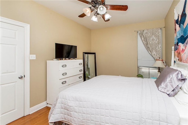 bedroom with light hardwood / wood-style flooring and ceiling fan