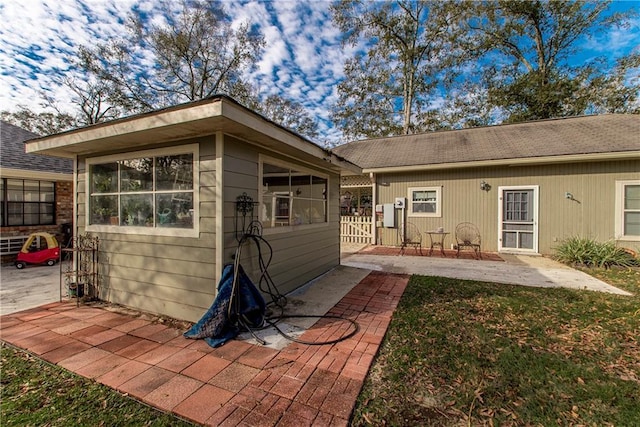 back of house with a patio