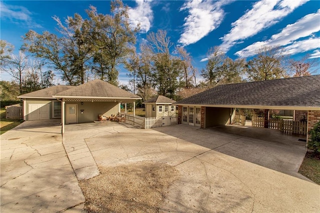 view of front of house with a garage and french doors