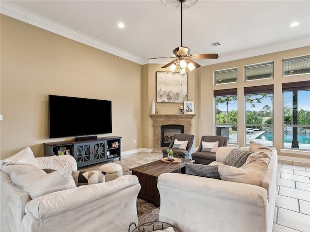 living room featuring crown molding, light tile patterned floors, and ceiling fan