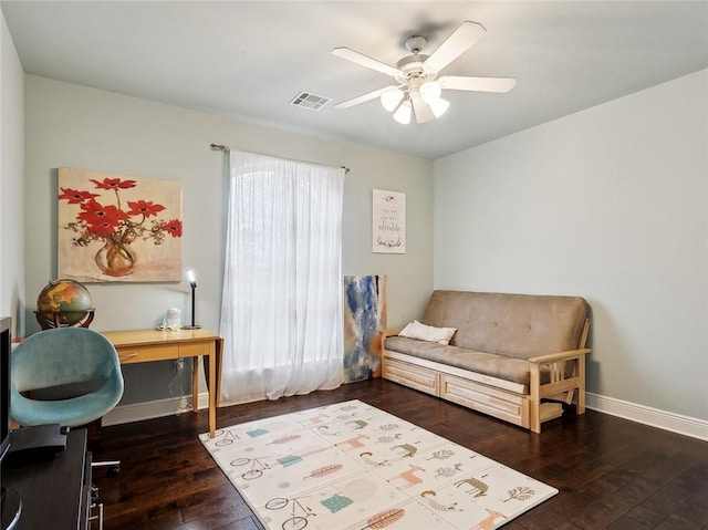 interior space featuring ceiling fan and dark hardwood / wood-style flooring