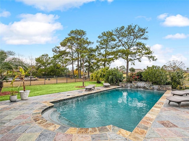 view of swimming pool featuring a patio area, a lawn, and pool water feature