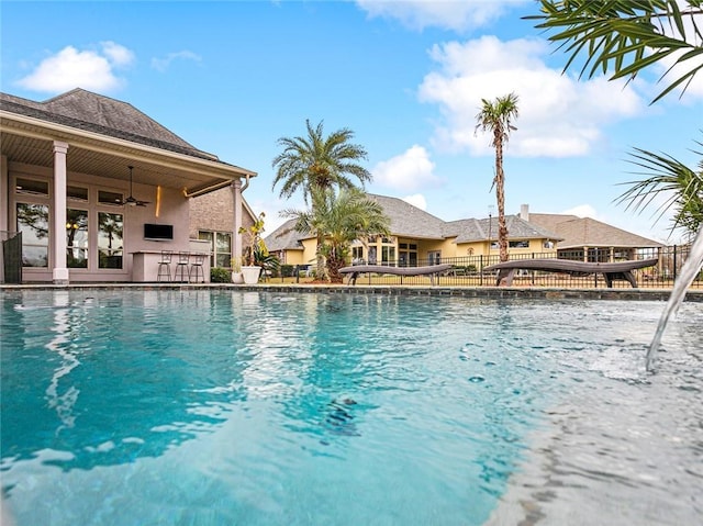 view of pool with ceiling fan