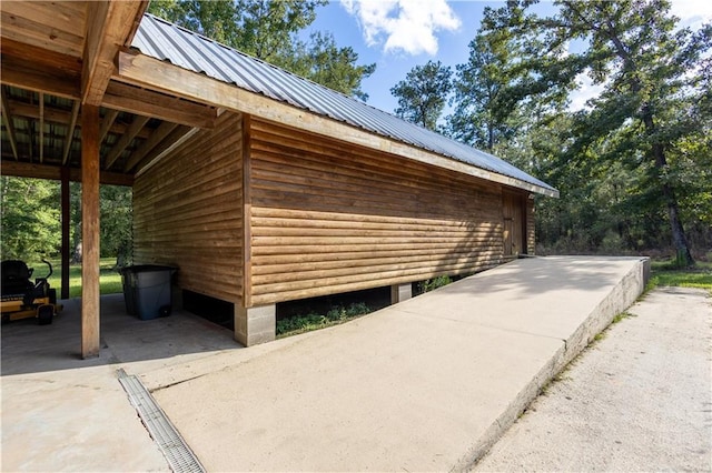 view of property exterior featuring metal roof