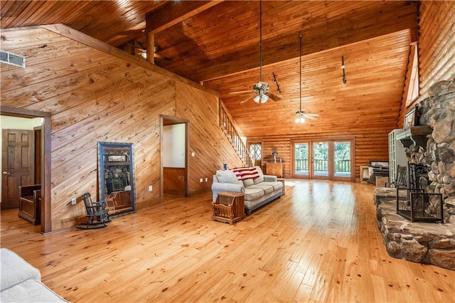 living area featuring wood-type flooring, high vaulted ceiling, and wood ceiling