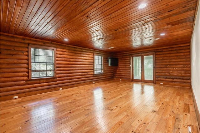 spare room with log walls, recessed lighting, french doors, wood-type flooring, and wooden ceiling