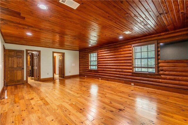 unfurnished room featuring baseboards, wood ceiling, recessed lighting, light wood-style flooring, and log walls