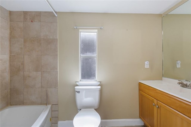 full bathroom with tiled shower / bath combo, vanity, and toilet