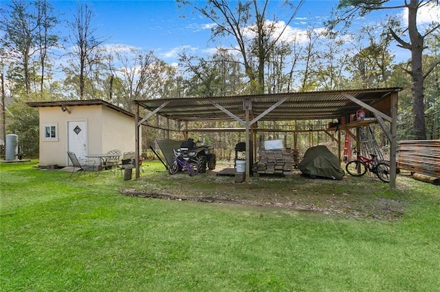 view of outbuilding featuring a lawn