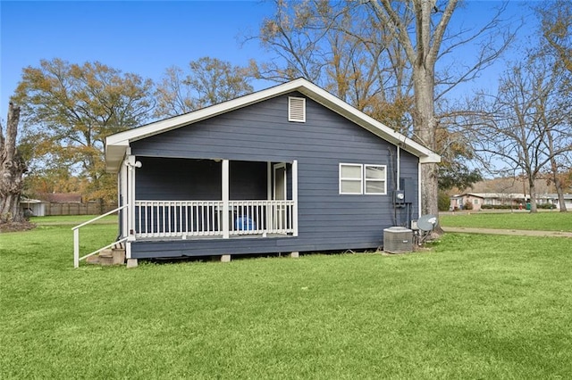 exterior space with a yard and cooling unit