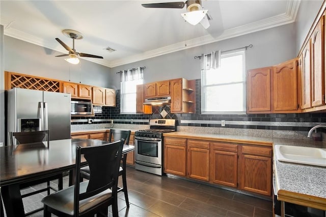 4937-39 S Miro St, New Orleans, LA 70125 - kitchen featuring under cabinet range hood, a ceiling fan, appliances with stainless steel finishes, and a sink