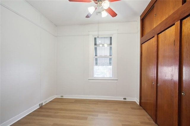 unfurnished bedroom with light wood-type flooring and ceiling fan