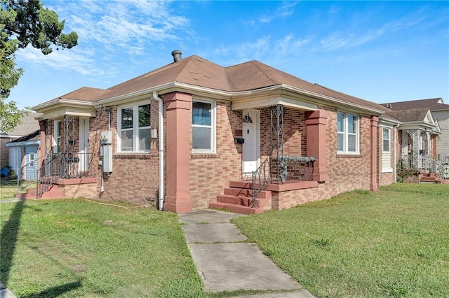 view of front of home with a front lawn