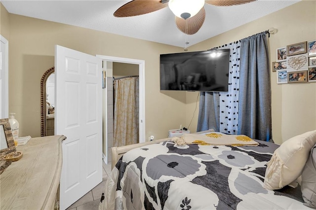 bedroom with light tile patterned floors and ceiling fan