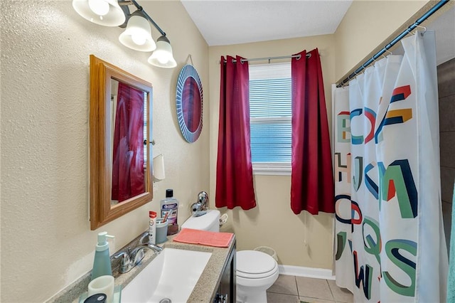 bathroom featuring tile patterned floors, toilet, a shower with shower curtain, and vanity