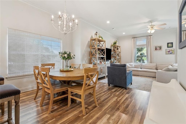 dining room with hardwood / wood-style flooring, ceiling fan, and crown molding