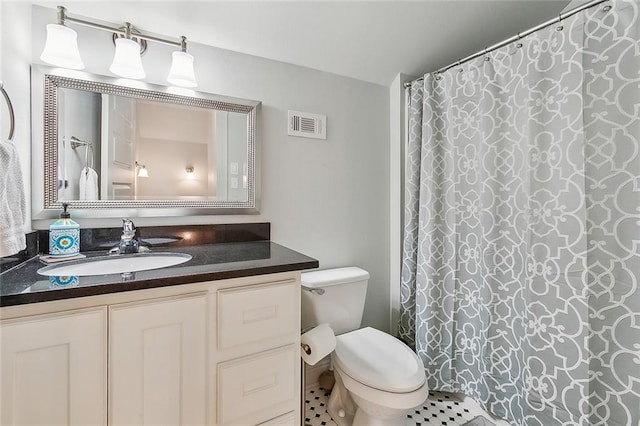 bathroom with vanity, toilet, tile patterned floors, and a shower with curtain