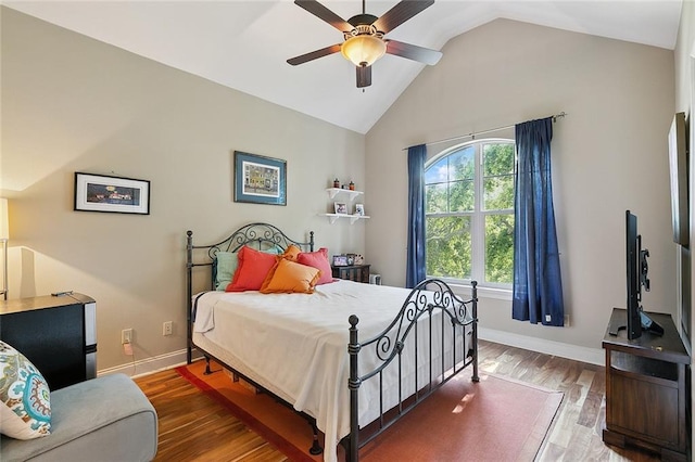 bedroom featuring hardwood / wood-style flooring, ceiling fan, and lofted ceiling