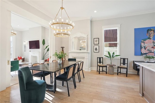 dining space with crown molding, light hardwood / wood-style floors, and a chandelier