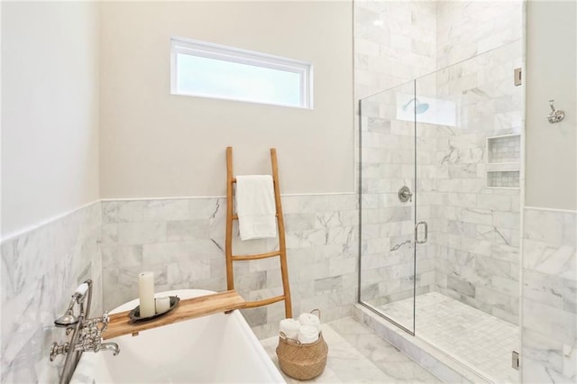 bathroom featuring a shower with door