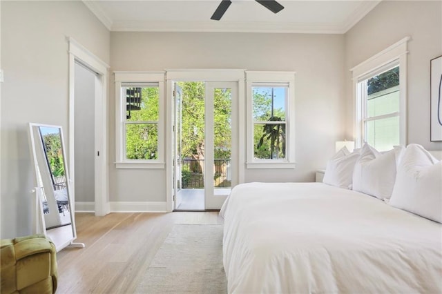 bedroom with ceiling fan, light wood-type flooring, multiple windows, and access to outside