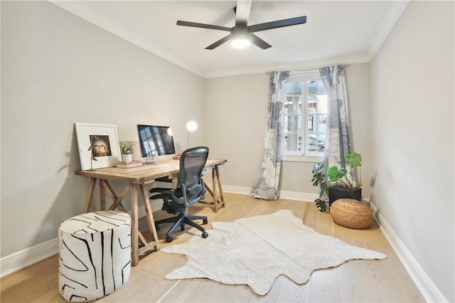 office featuring crown molding, ceiling fan, and light hardwood / wood-style flooring