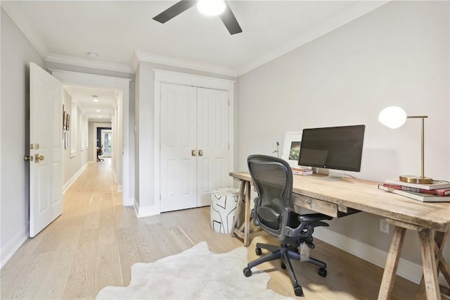 home office featuring crown molding, ceiling fan, and light wood-type flooring