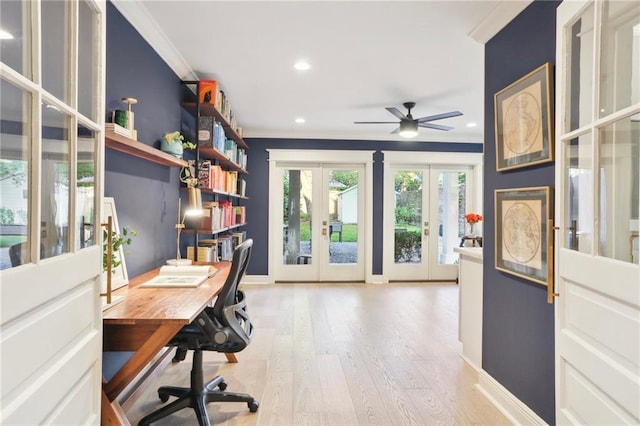 office area featuring crown molding, light hardwood / wood-style flooring, ceiling fan, and french doors