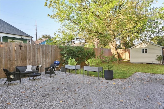 view of patio with a fire pit and a storage unit