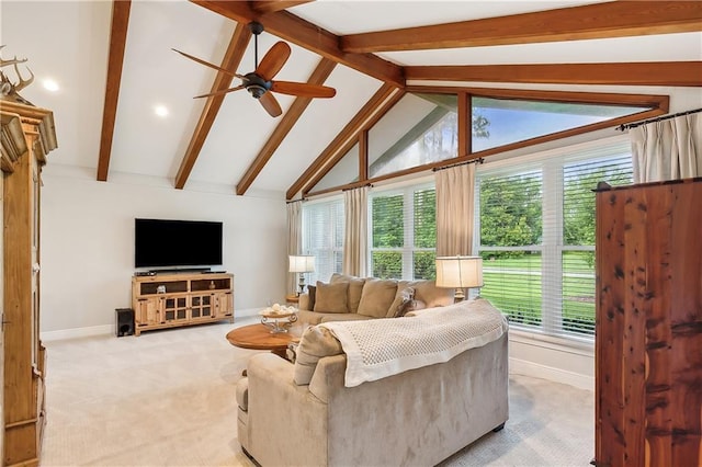 carpeted living room with vaulted ceiling with beams and ceiling fan