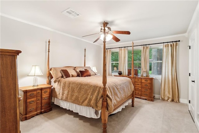 bedroom with ceiling fan and ornamental molding