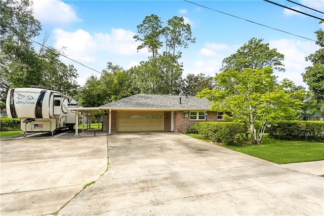 view of front of property featuring a garage, a front lawn, and a carport