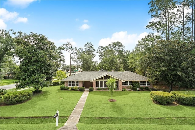 ranch-style home featuring a front yard