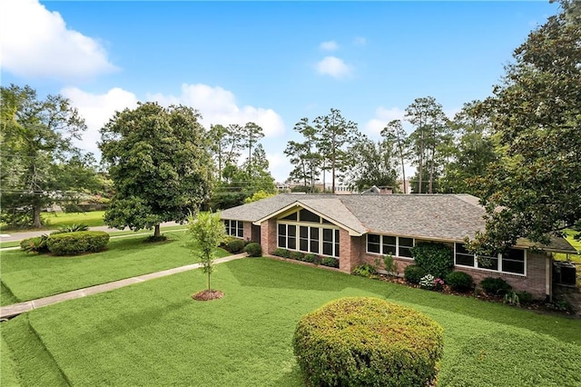 ranch-style house featuring a front lawn