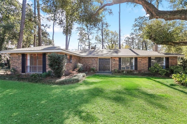 ranch-style house with a front lawn