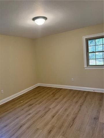 unfurnished room featuring hardwood / wood-style floors