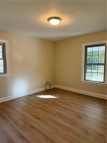 empty room featuring hardwood / wood-style flooring