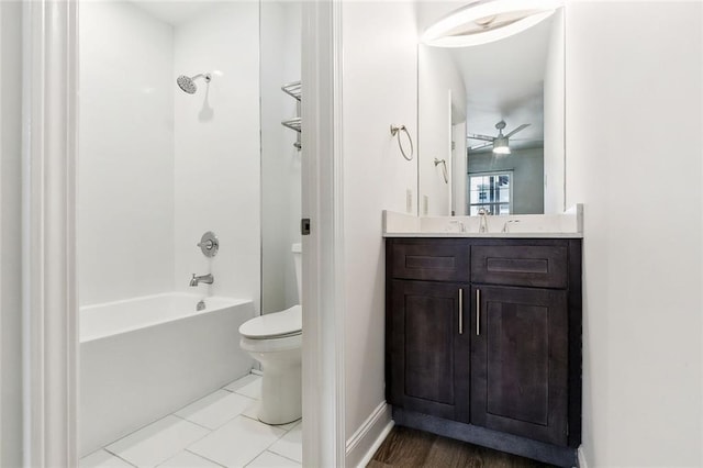 full bathroom with shower / tub combination, tile patterned floors, vanity, toilet, and ceiling fan