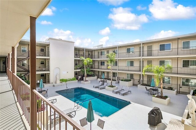 view of swimming pool with a patio