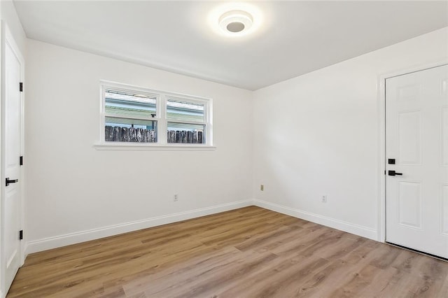 unfurnished room with light hardwood / wood-style flooring