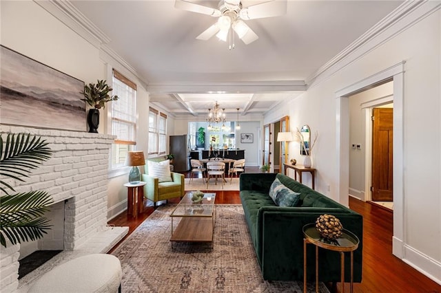 living room featuring beamed ceiling, a brick fireplace, crown molding, and dark hardwood / wood-style flooring