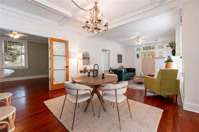 dining room with dark hardwood / wood-style flooring, ceiling fan with notable chandelier, beamed ceiling, and ornamental molding