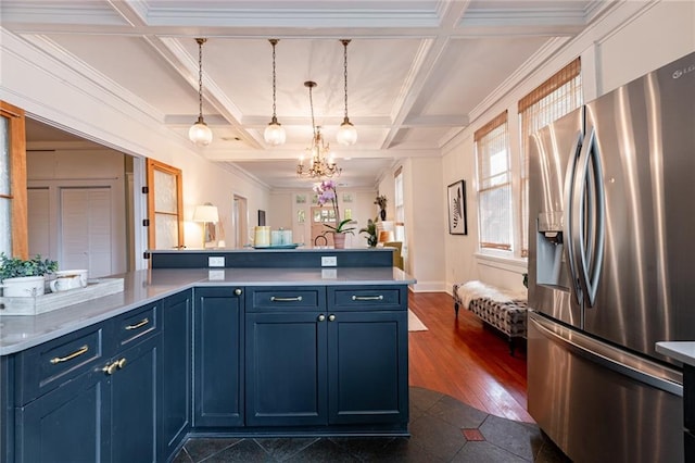 kitchen featuring stainless steel refrigerator with ice dispenser, pendant lighting, blue cabinetry, a notable chandelier, and coffered ceiling