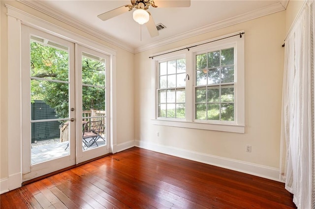 entryway featuring ornamental molding, dark hardwood / wood-style flooring, ceiling fan, and french doors